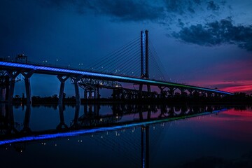 Illuminated suspended bridge in the darkness