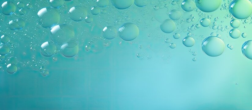 Close up view of transparent soap foam on blue and green resembling a cosmetic backdrop Copy space image Place for adding text or design