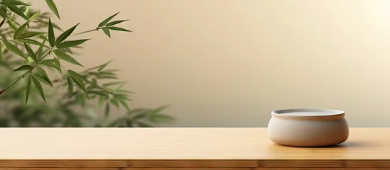 Fotobehang Chinese Zen presentation backdrop with oak table bamboo plants and beige wall Copy space image Place for adding text or design © Ilgun