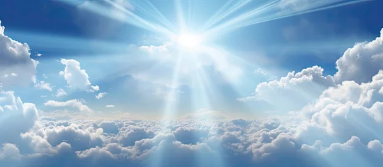 Foto op Plexiglas Beautiful cloudy sky with sunshine Peaceful natural background Sunny divine heaven Religion heavenly concept Copy space image Place for adding text or design © Ilgun