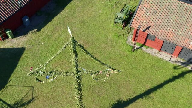 Sweden midsummer pole beautifull covered prepared for celebration green flowers