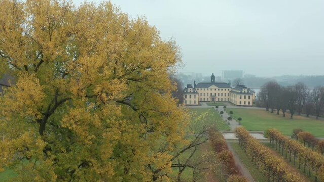 Castle in fall. Foggy morning in royal park in Stockholm Ulriksdal Sweden