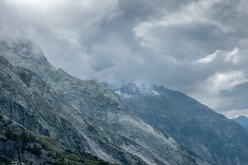 Peaks getting hidden by the clouds in the Alps
