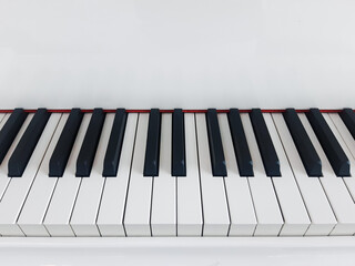 Close up of piano keyboard.Black and white keyboard keys. Parts of the piano. Play musical instrument.