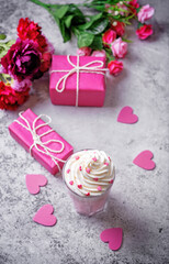 Hot white chocolate cocktail for Valentine's day holidays on a grey background