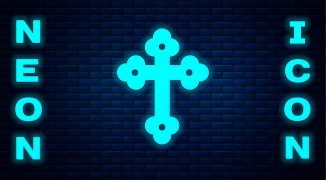Glowing neon Christian cross icon isolated on brick wall background. Church cross. Vector