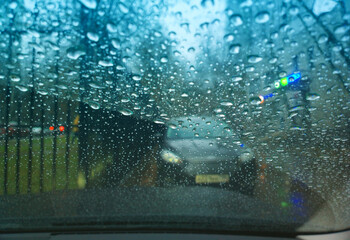 Raindrops on car's window glass background