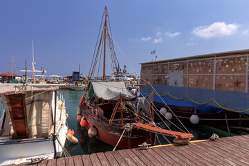 Fototapeta na wymiar Traditional colorful fishing boats along the Rhodes waterfront.