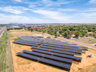 Aerial view, of Gaborone capital city of Botswana, solar panels above crops ensuring fresh...