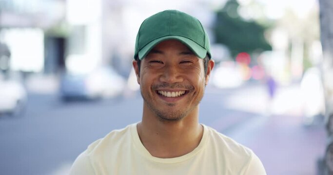 Face, smile and an asian man on a street in the city for travel as a tourist to explore or discover. Portrait, road and a happy young person on the sidewalk of an urban town during a summer day
