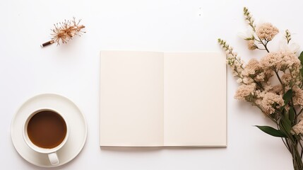  an open book next to a cup of coffee and a vase of flowers on a white table with a white background.
