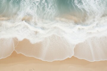 Fototapeta na wymiar Aerial view of pristine beach waves creating rhythmic patterns on the sand