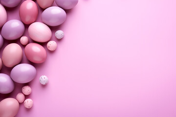 Flat lay of easter eggs in a pastel pink background with empty space for text. Banner, backdrop. Top view