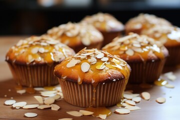 Banana muffins with a honey glaze and almond sprinkle