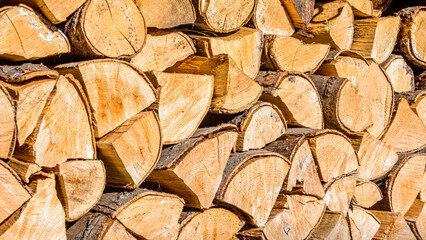 Chopped firewood piled up. Background concept of firewood