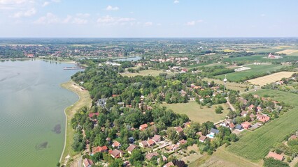 Aerial view of the villages on the shores of Palic Lake on a sunny day in Serbia - obrazy, fototapety, plakaty