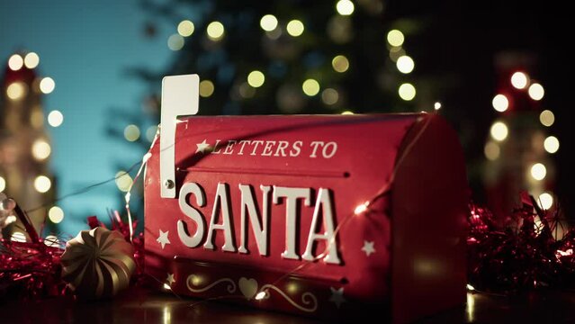 Christmas Santa letterbox with tree and lights in the background