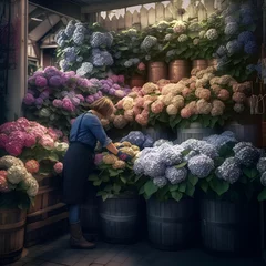 Poster Woman choosing hydrangea flowers in a flower shop. Flower market. © Muhammad