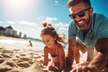 Father and daughter work together building a sand castle at beach. Summer tropical vacation concept.