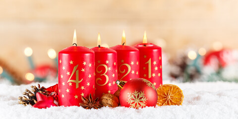 Fourth 4th Sunday in advent with burning candle Christmas time decoration panorama with copyspace...