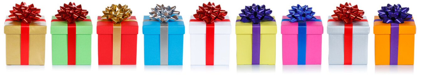 Many colorful christmas presents birthday gifts in a row panorama isolated on a white background