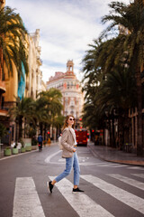 Fototapeta na wymiar Beautiful woman walking in the city of Valencia, Spain