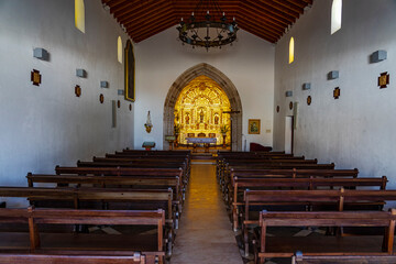 Centered and symmetrical image of the interior of the Catholic church in the Algarve region of...