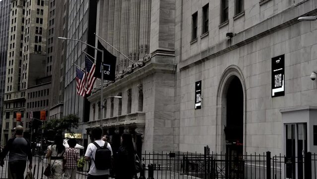 Tilt down New York Stock exchange Downtown Manhattan New York City
