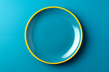 Blue plate with yellow border mockup on blue background. Top view, flat lay. Generative AI.