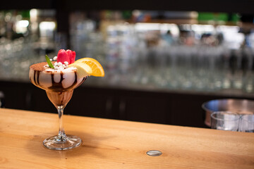 Closeup shot of a beautifully decorated tiramisu dessert at the bar