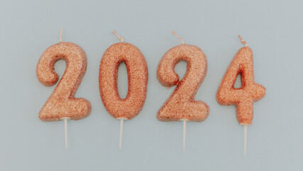 Candles numbers 2024 on a blue background.