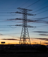 Fototapeta premium Electrical substation and power lines at sunset