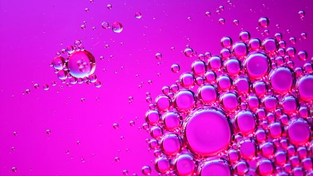 Abstract bubbles floating background. Liquid purple abstract backdrop. Flowing colorful abstract rounds. Beautiful violet floating texture. Liquid Art Wallpaper. Flowing Surface, slow motion. 