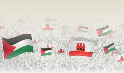 Palestine and Gibraltar flags in a crowd of cheering people.