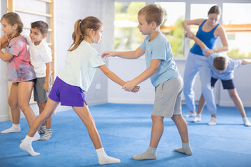 Children are focusing on their hand grip techniques to develop better control and power