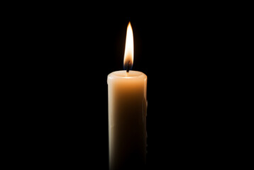 A candle lit against a black background, in the style of outlandish energy