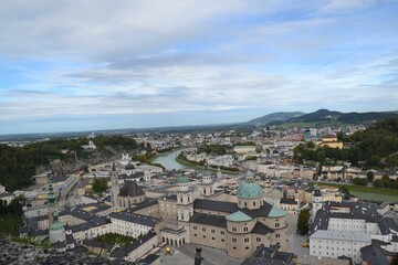Fototapeta na wymiar Salzburg cityscape with the historic Cathedral on a cloudy day