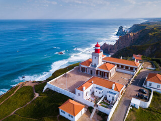 Scenic aerial view of lighthouse at cape Cabo da Roca in sunny spring day, Portugal - obrazy, fototapety, plakaty