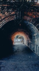 Vertical shot of an arch of a tunnel in the city