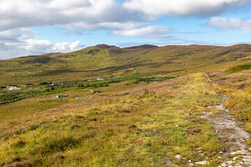 Fototapeta na wymiar Houses, Vegetation and mountains in Achill Island