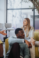 Fototapeta premium Diverse professionals collaborate in a modern office, fostering innovation, efficiency, and success. This multinational team excels in problem-solving, profitability, and project execution.