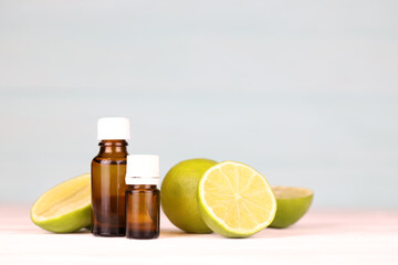 Oil essence bottle with citrus extracts. Selective focus. Spa day, concept of freshness oil bottle with lime extract