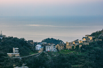 Fototapeta premium Xiaoruo Village, Wenling City, Taizhou City, Zhejiang Province - sea view and fishing village at sunrise