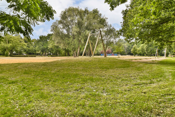 an empty park with trees and grass in the fore - image was taken from google street, south london stock photo