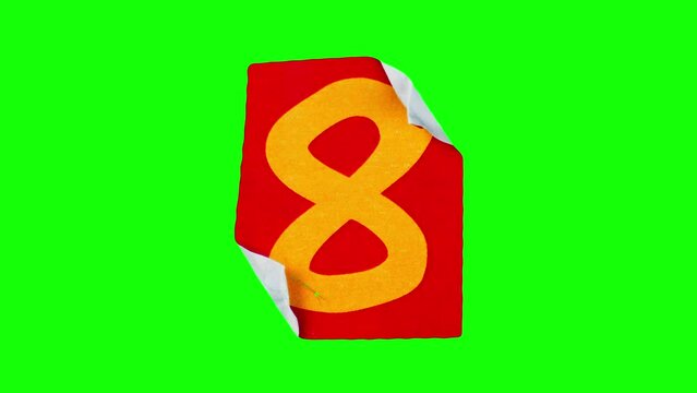 Stop motion animation with red sticker and orange number eight on it filmed against chroma key. Isolated paper with numeral figure crumpling and unwrapping on green screen. Learning funny collage