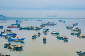 Xiaoruo Village, Wenling City, Taizhou City, Zhejiang Province - high angle view of fishing village and fishing port at sunrise