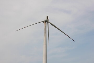 Fototapeta premium Close-up shot of a wind turbine against the clear sky