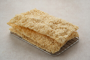 Kerupuk Gendar or Gendar Cracker, made from thinly shaped rice, dried and then fried. Indonesian food
