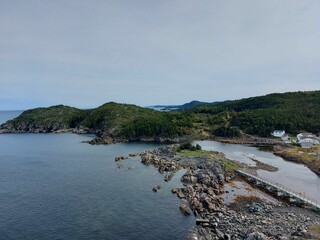 Aerial view of a lake with coastline stones and rocks