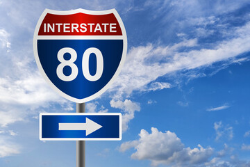 Red and blue road sign for interstate 80 highway,